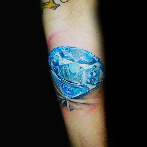 Natural looking blue colored pure diamond tattoo on arm