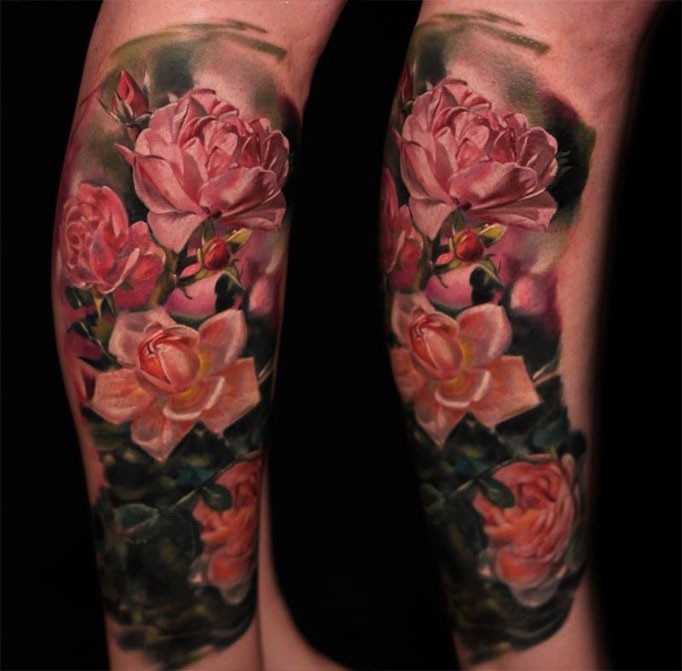 Natural looking colored arm tattoo of beautiful roses