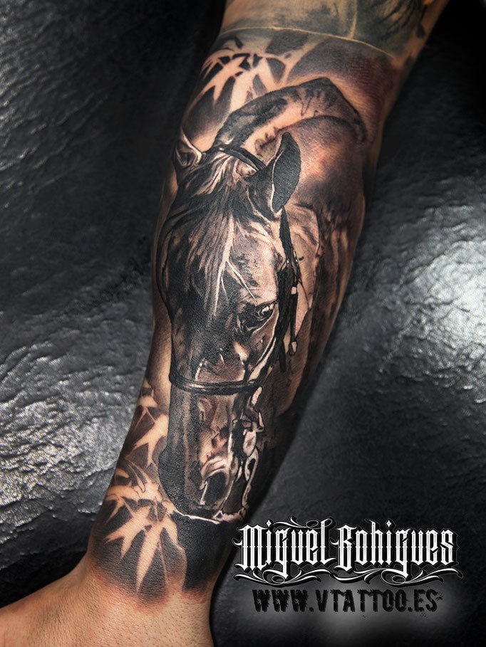 Natural looking colored arm tattoo of big horse head
