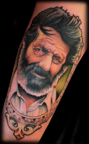 Natural looking colored arm tattoo of old man portrait