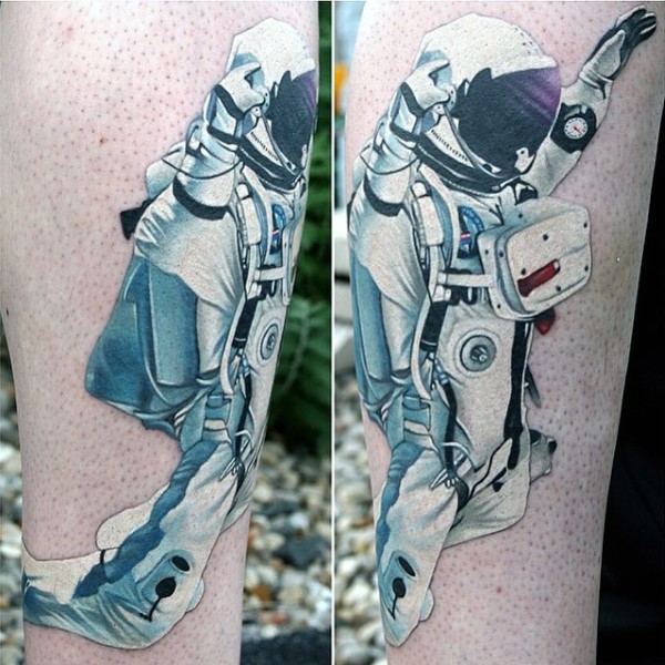 Natural looking colored big astronaut tattoo on arm