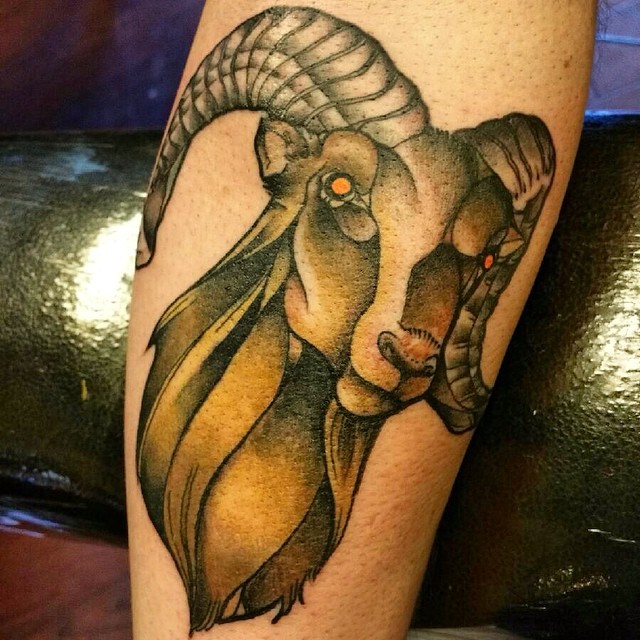 Natural looking colored big goat head tattoo