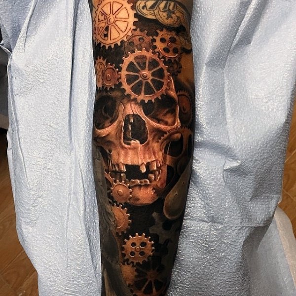 Natural looking colored big old skull with mechanical parts tattoo on sleeve