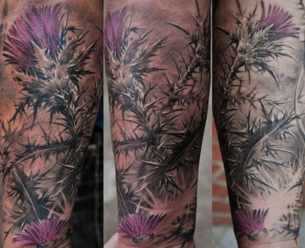 Natural looking colored forearm tattoo of wildflower