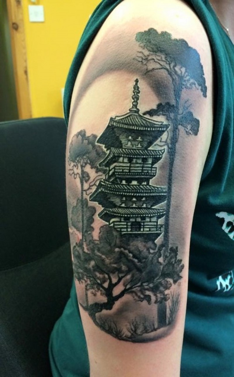 Natural looking colored shoulder tattoo of night Asian house with big trees