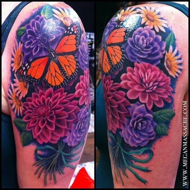 Natural looking colored shoulder tattoo of big flowers with butterfly