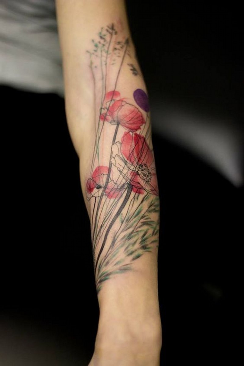 Natural looking colored sweet flower tattoo on arm