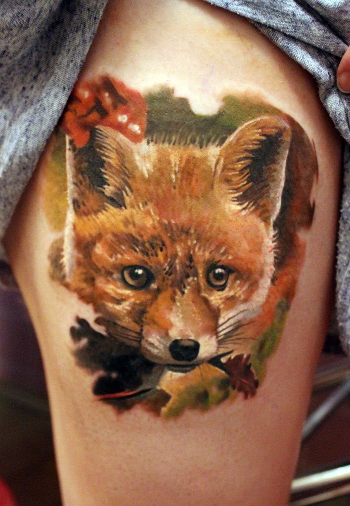 Natural looking colored thigh tattoo of funny fox