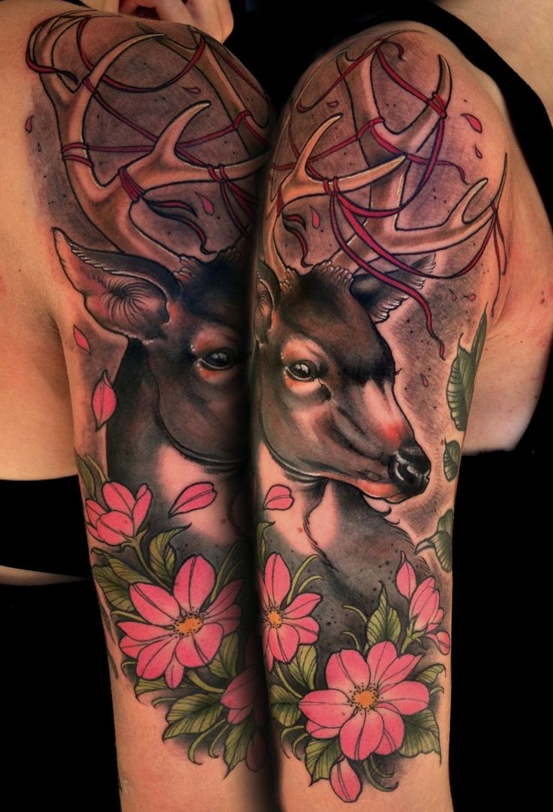 Natural looking detailed colored shoulder tattoo of deer and flowers