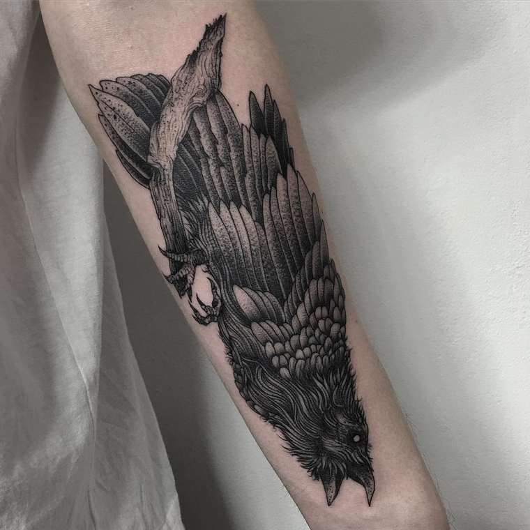 Natural looking detailed forearm tattoo of big crow