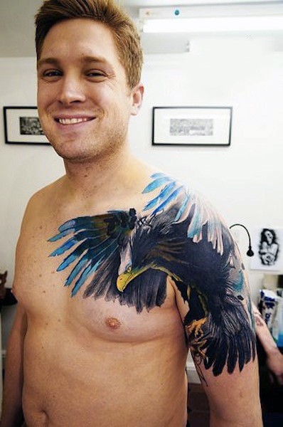Natural looking multicolored eagle shoulder and chest tattoo