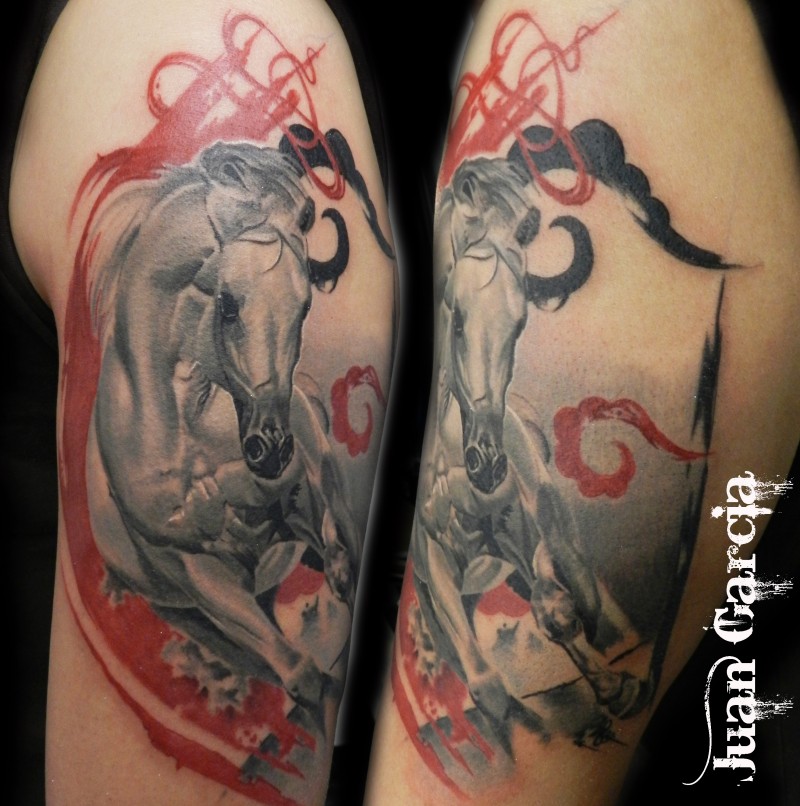 Natural looking multicolored shoulder tattoo of running horse