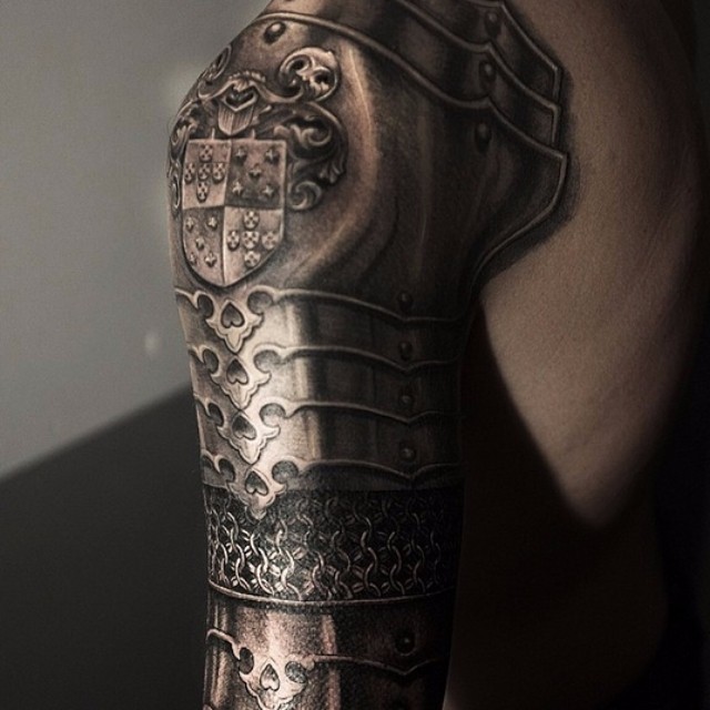 Natural looking very detailed colored shoulder tattoo of medieval armor