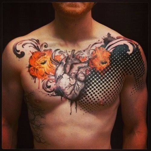 Natural looking very detailed human heart tattoo on chest with colored flowers and ornaments
