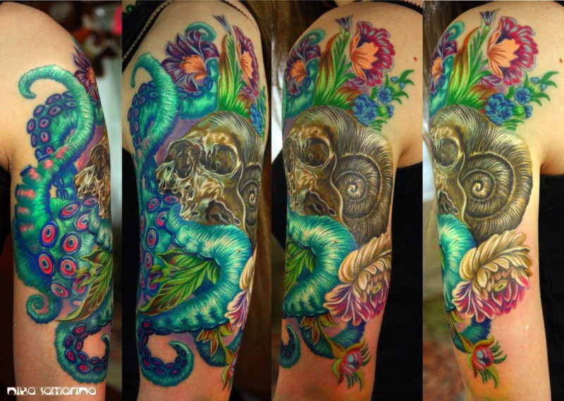 Natural looking very detailed shoulder tattoo of human skull with octopus and flowers