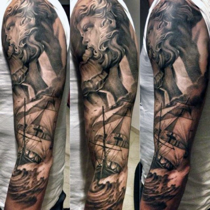 Nautical themed black and white Poseidon with ship tattoo on sleeve