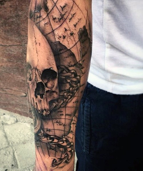 Nautical themed detailed black ink world map with skull tattoo on sleeve