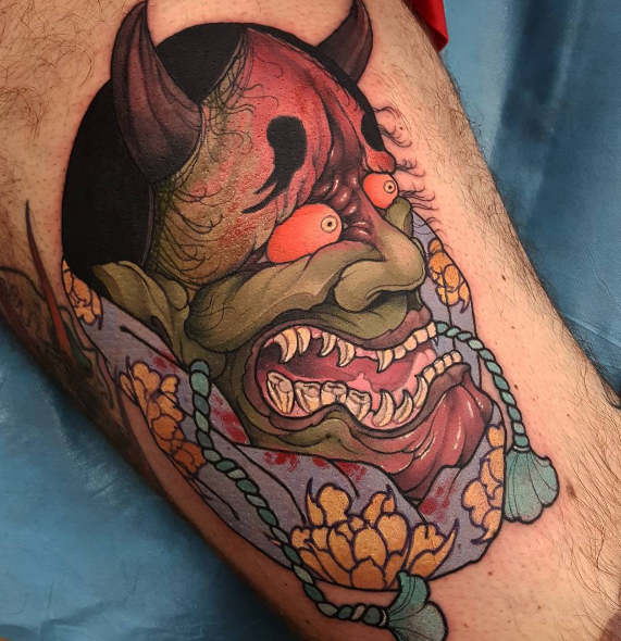 Neo japanese style accurate looking tattoo of demon face with flowers