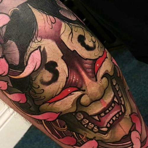Neo japanese style colored arm tattoo of creepy monster mask