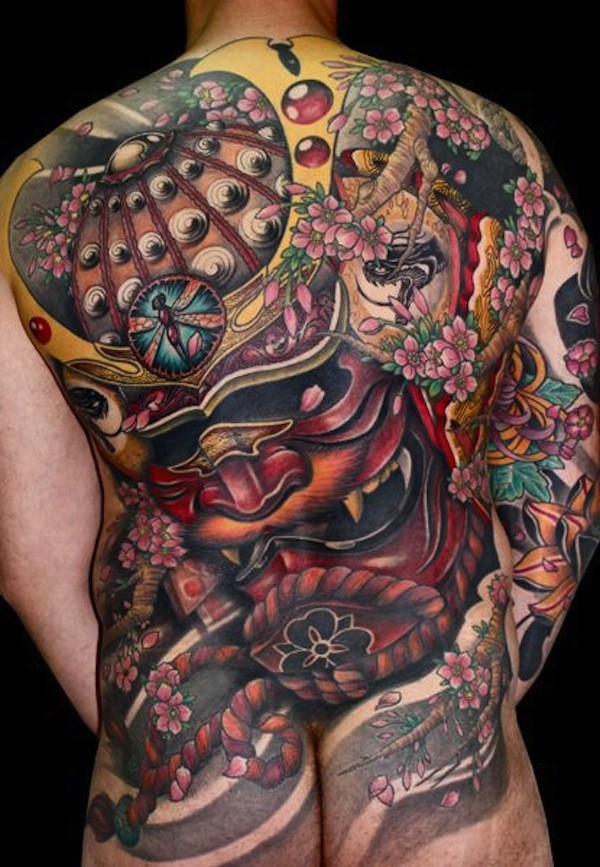 Neo japanese style colored whole back tattoo of samurai mask with flowers