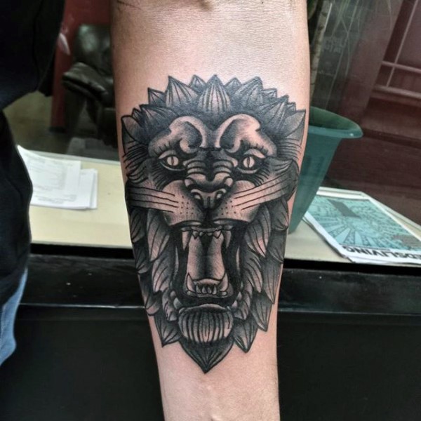 Neo traditional forearm tattoo of lion face