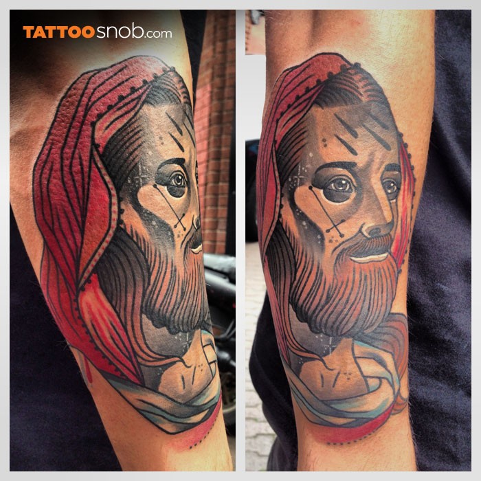 Neo traditional style colored arm tattoo of Jesus face
