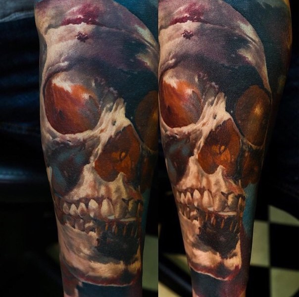 Neo traditional style colored arm tattoo of nice looking human skull