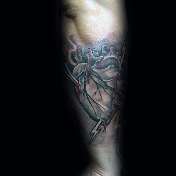 Neo traditional style colored arm tattoo of human heart with lightning