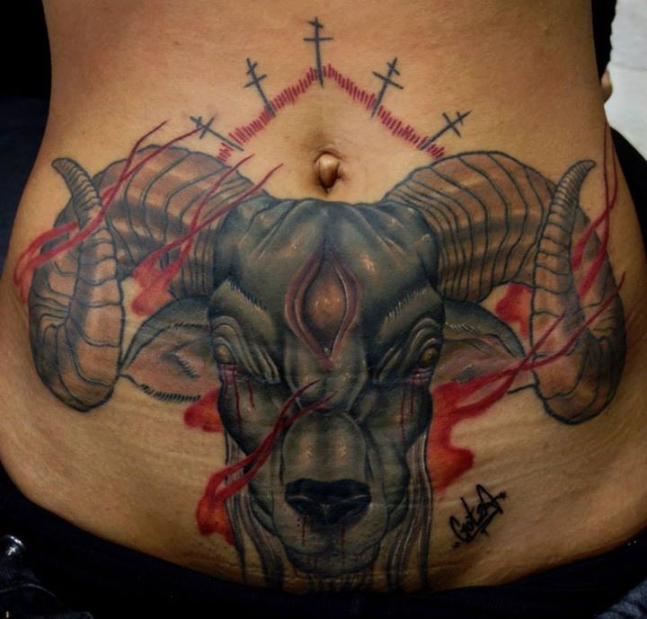 Neo traditional style colored belly tattoo of demonic goat with crosses