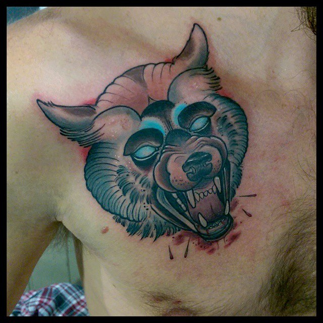 Neo traditional style colored chest tattoo of bloody demonic dog