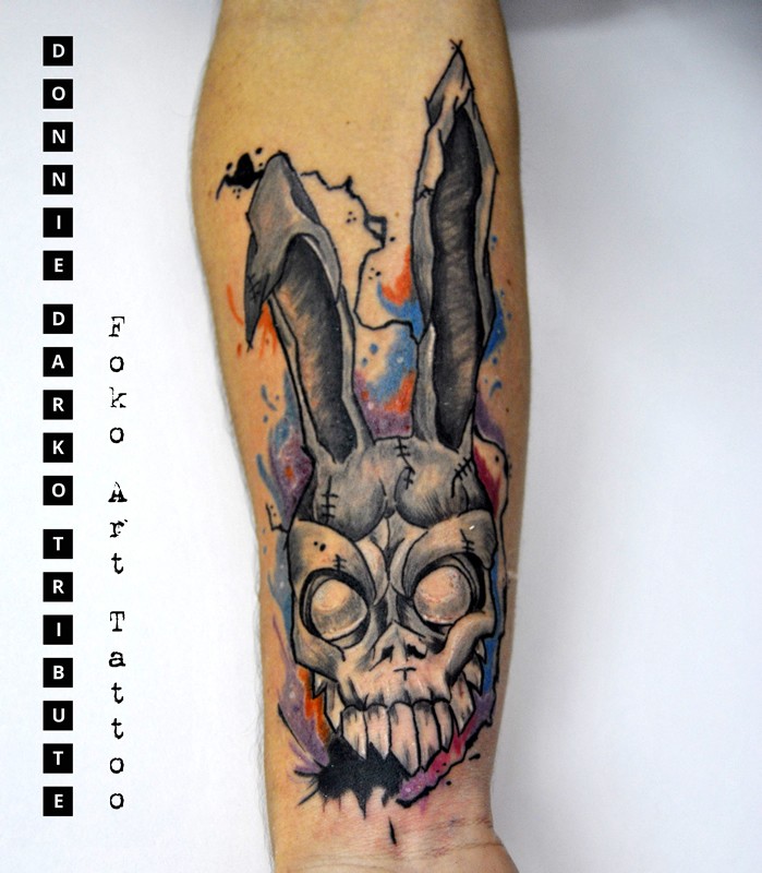 Neo traditional style colored forearm tattoo of creepy bunny head