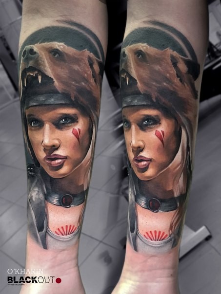 Neo traditional style colored forearm tattoo of woman face with bear
