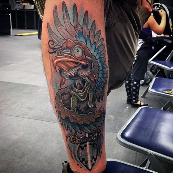 Neo traditional style colored Indian bird with wings tattoo on leg