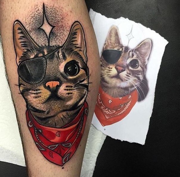 Neo traditional style colored leg tattoo of funny cat with eye patch