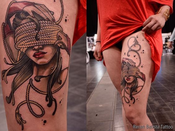 Neo traditional style colored thigh tattoo of woman with roped eyes