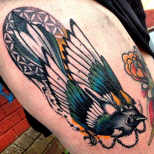 Neo traditional style colored thigh tattoo of beautiful bird