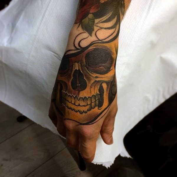 New school colored hand tattoo of human skull and flower