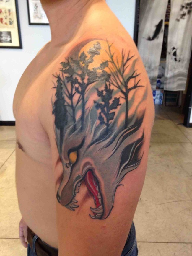 New school illustrative style demonic wolf with forest tattoo on shoulder