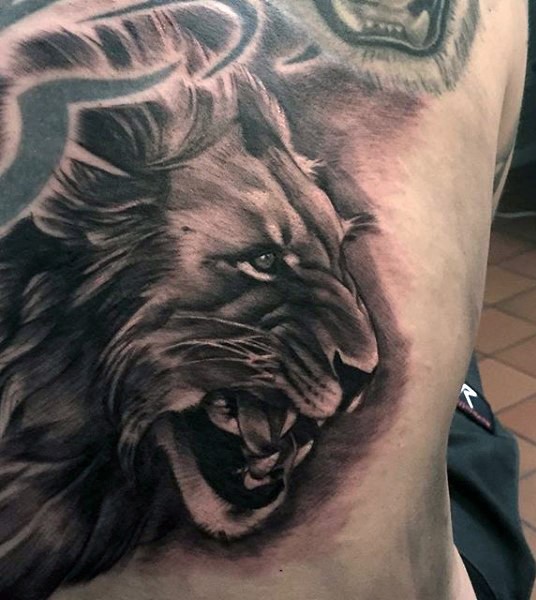 New school style black and white back tattoo of lion head
