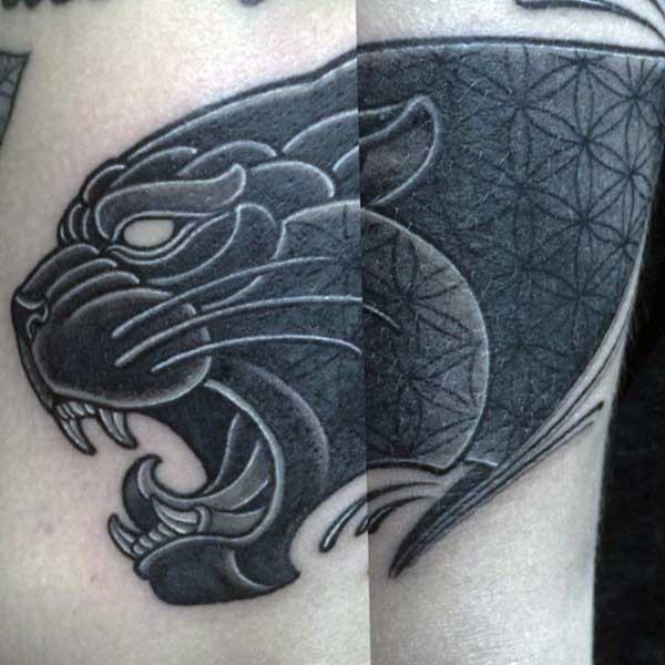 New school style black ink black panther tattoo stylized with ornaments