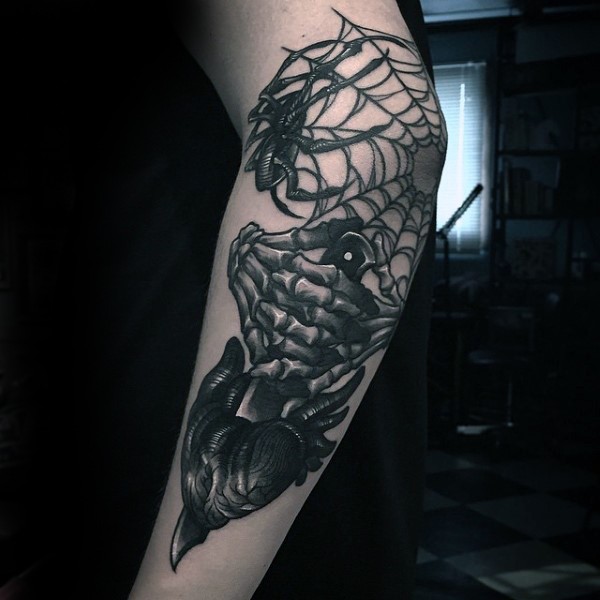 New school style black ink elbow tattoo of spider web and skeleton hand