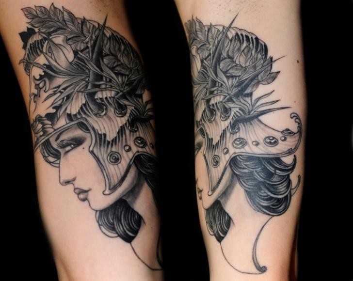 New school style black ink forearm tattoo of woman in great helmet