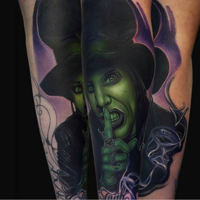 New school style colored arm tattoo of Merlin Manson