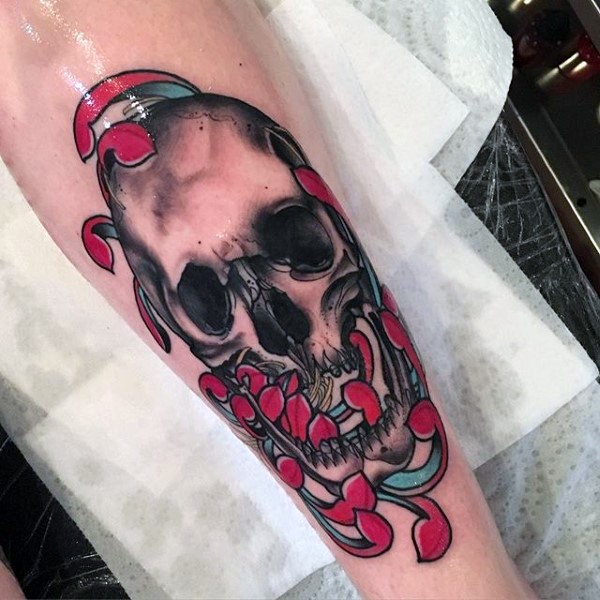 New school style colored arm tattoo of human skull with flowers