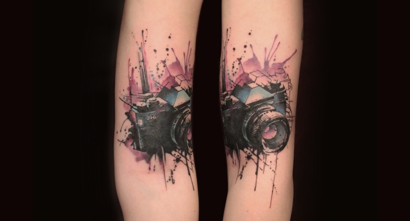 New school style colored arm tattoo of small camera