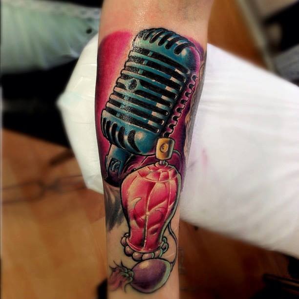 New school style colored arm tattoo of microphone and perfume bottle