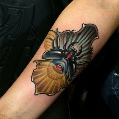 New school style colored arm tattoo of fantasy bug