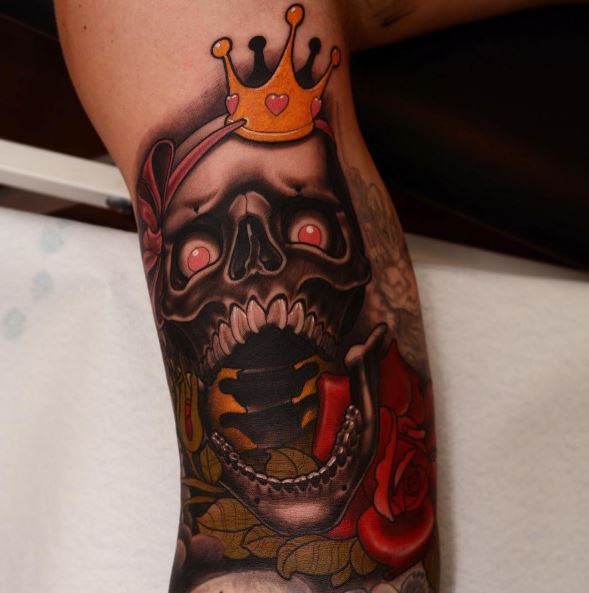 New school style colored arm tattoo of scary human skull with crown and roses