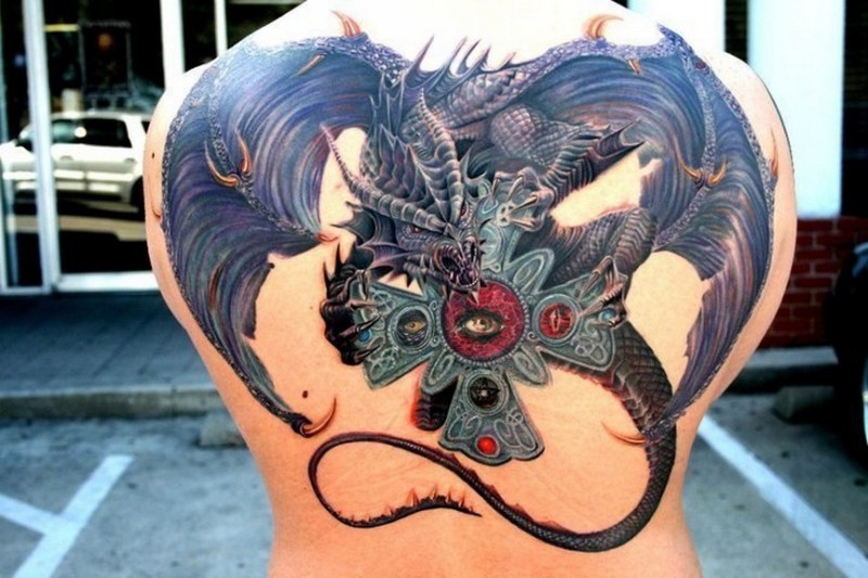 New school style colored back tattoo of fantasy dragon with iron cross