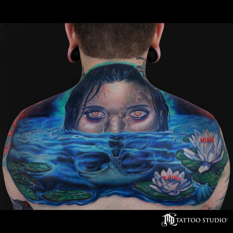 New school style colored back tattoo of swimming woman with skull and flowers